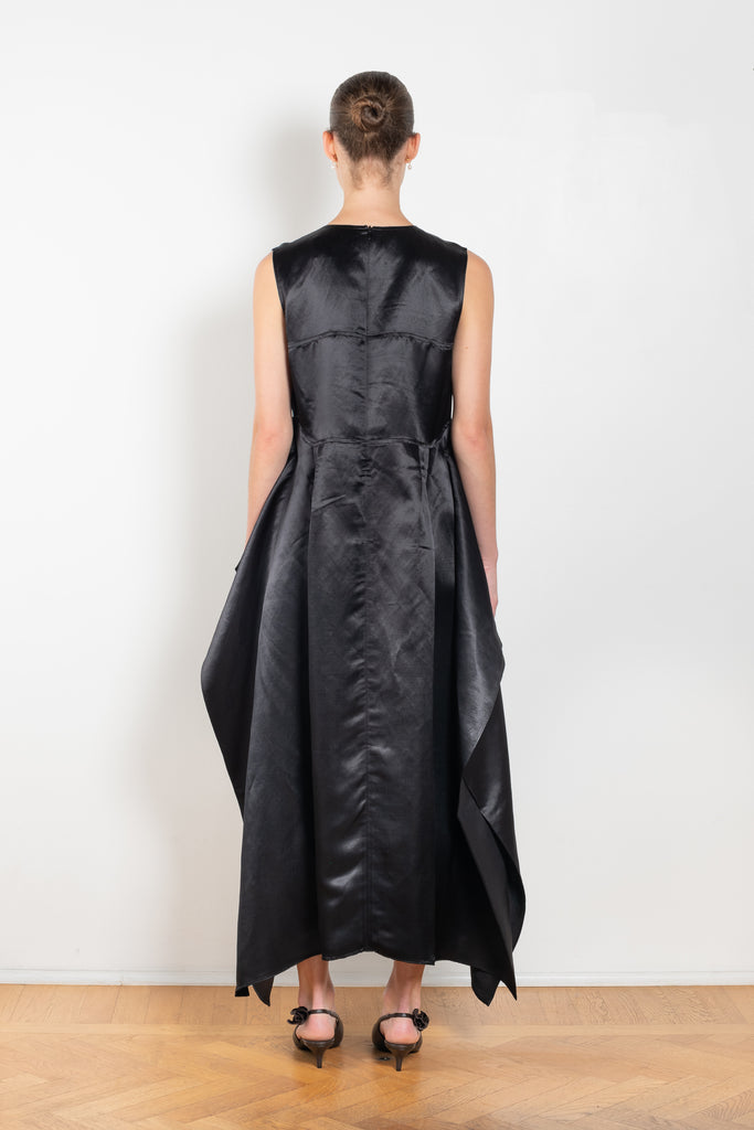 The Into My Arms Dress by Nackiye is an elegant sleeveless dress with a handkerchief detail on the skirt
