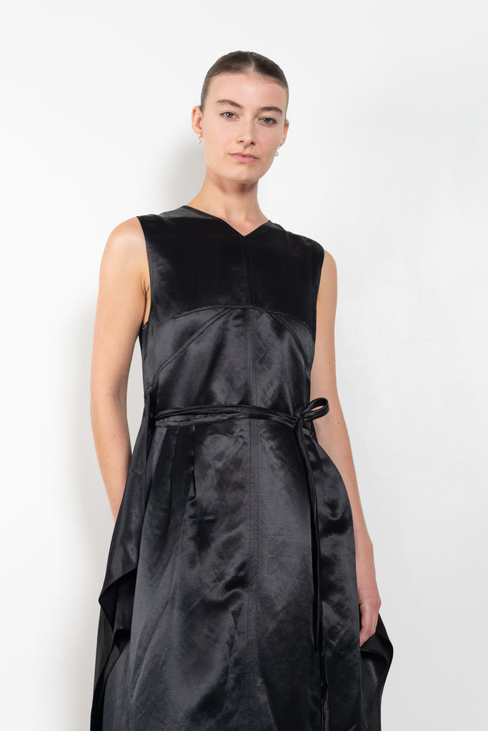 The Into My Arms Dress by Nackiye is an elegant sleeveless dress with a handkerchief detail on the skirt
