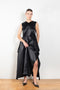 The Into My Arms Dress by Nackiye is an elegant sleeveless dress with a handkerchief detail on the skirt