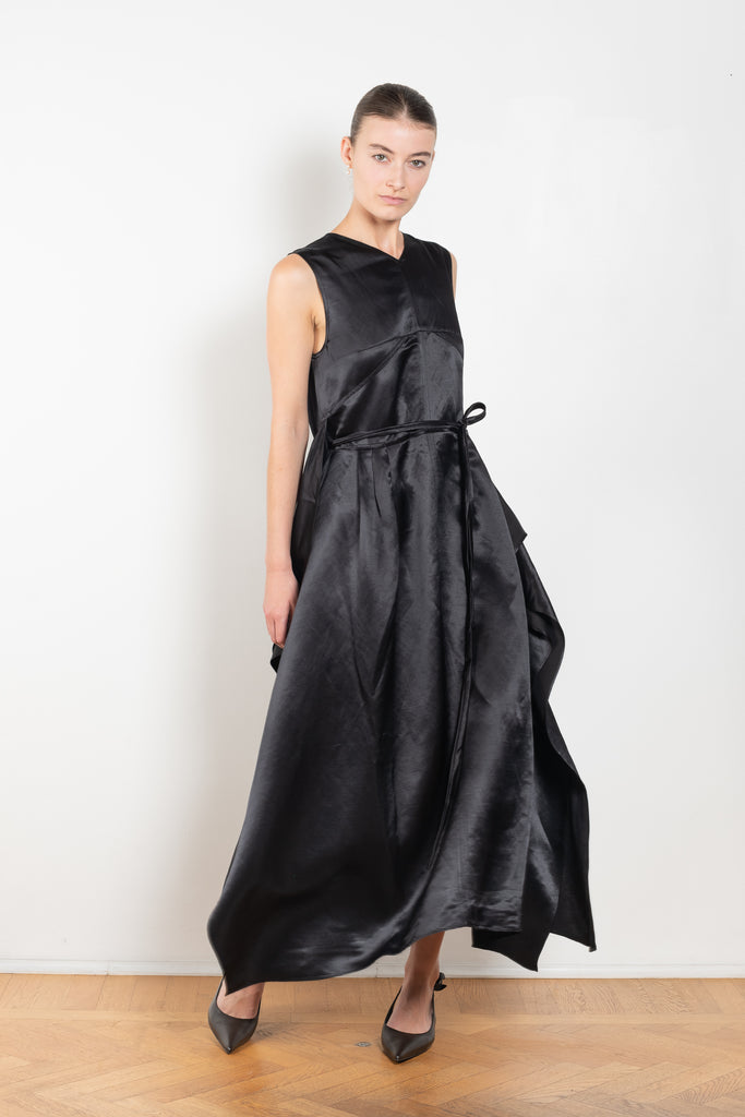 The Into My Arms Dress by Nackiye is an elegant sleeveless dress with a handkerchief detail on the skirt