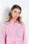 The Kawai Shirt by Nackiye is a classic cropped shirt with tapered sleeves and hand raped ruffle detail with raw edges