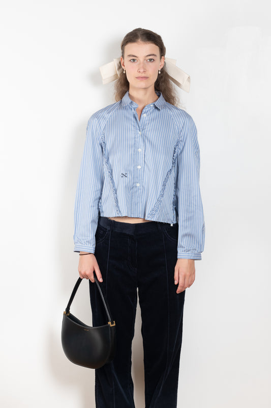 The Moshi Moshi Top by Nackiye is a buttoned up tailored shirt with front and back ruffles