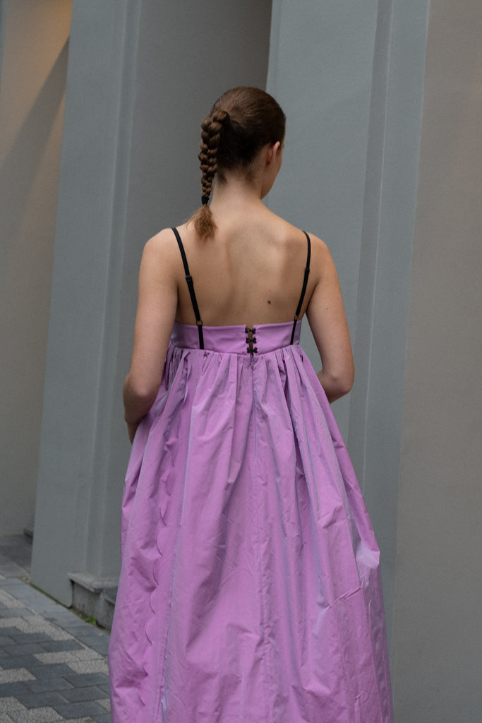 The Octopus Dress by Nackiye is a flowy dress with scalloped edges and a playfull contrasted trim