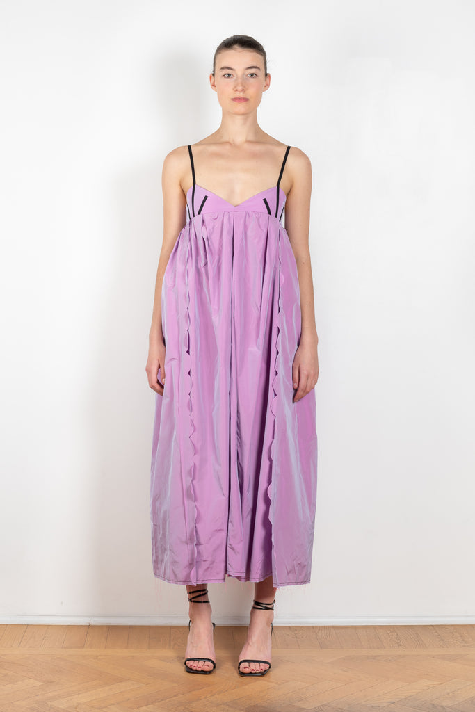 The Octopus Dress by Nackiye is a flowy dress with scalloped edges and a playfull contrasted trim