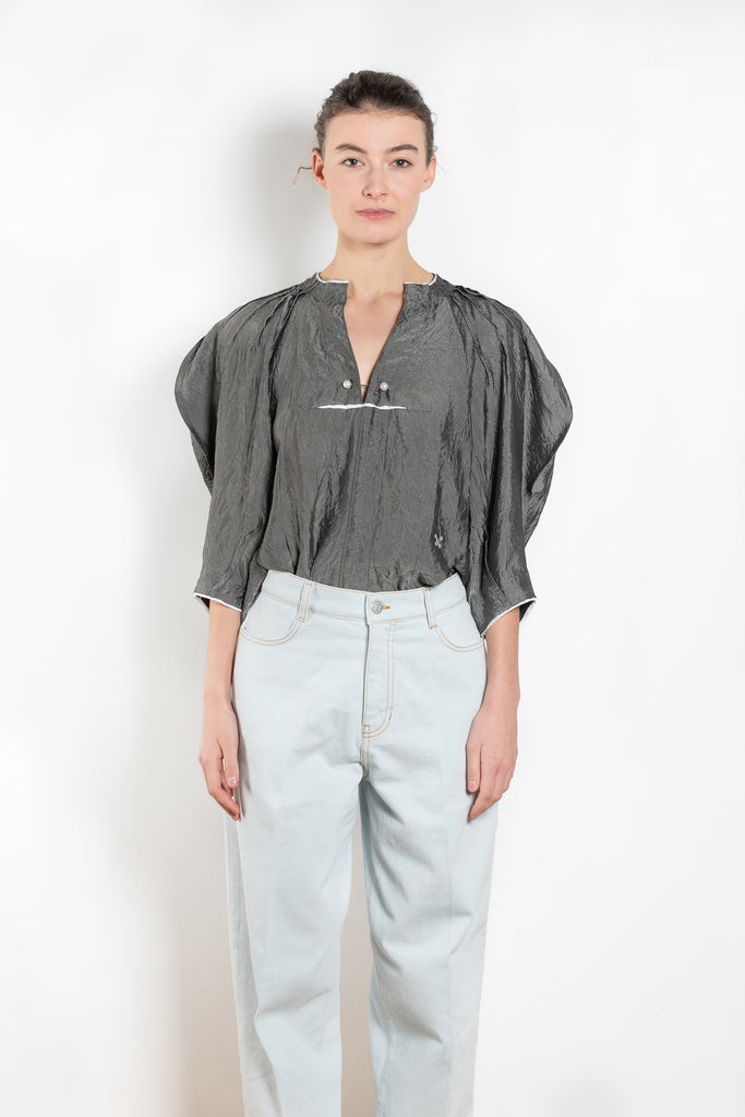 The Odalique Mini Top  by Nackiye is an elegant top with scallop sleeves