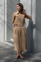The Shortcut Shirt by Nackiye is a crop shirt with pointy collar and faux front pockets. 