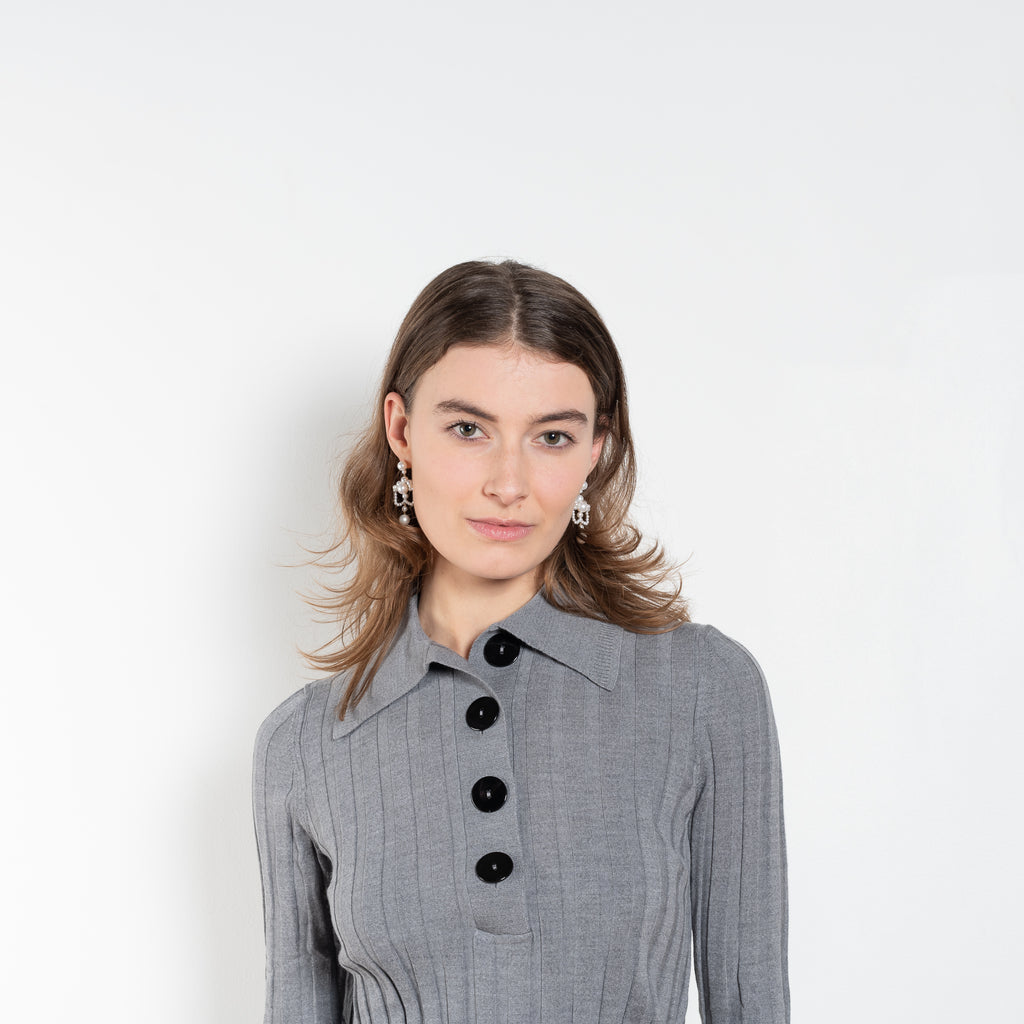 The Sugarman Polo by Nackiye is a fine knit polo with mother of pearl buttons