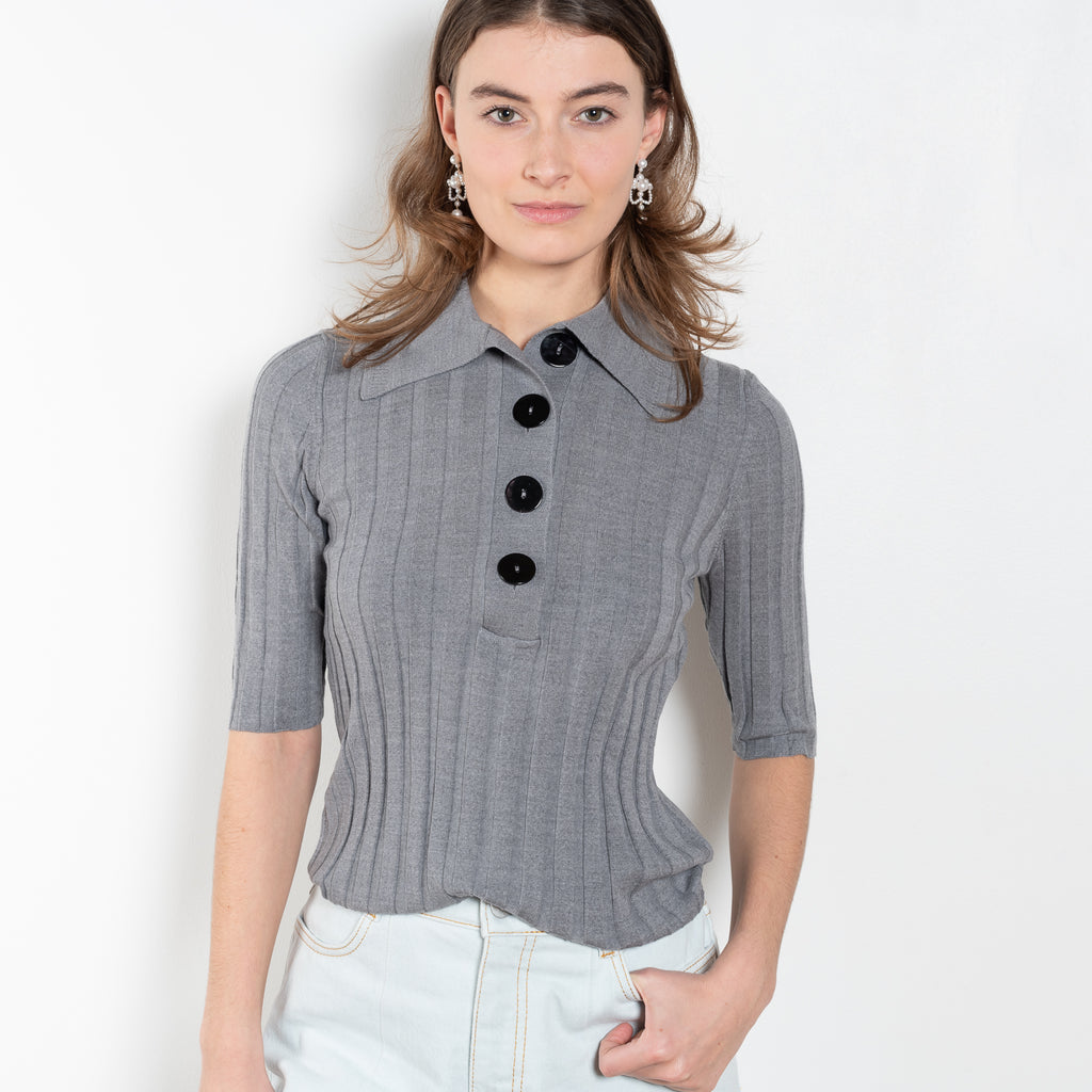 The Sugarman Polo by Nackiye is a fine knit polo with mother of pearl buttons