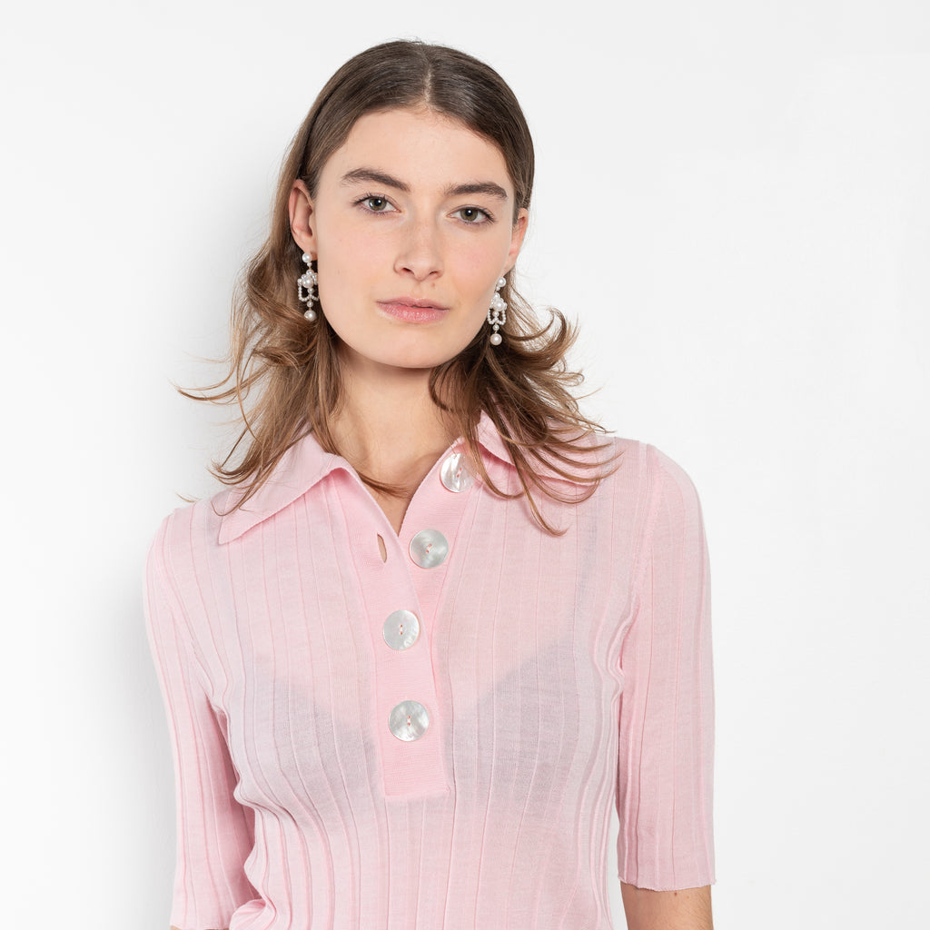 The Sugarman Polo by Nackiye is a fine knit polo with mother of pearl buttons