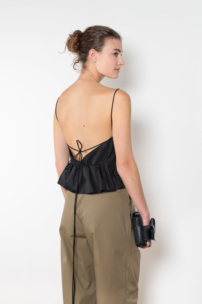 The Surf Rider Top by Nackiye is a delicate strappy top in cotton with a ruffle hem