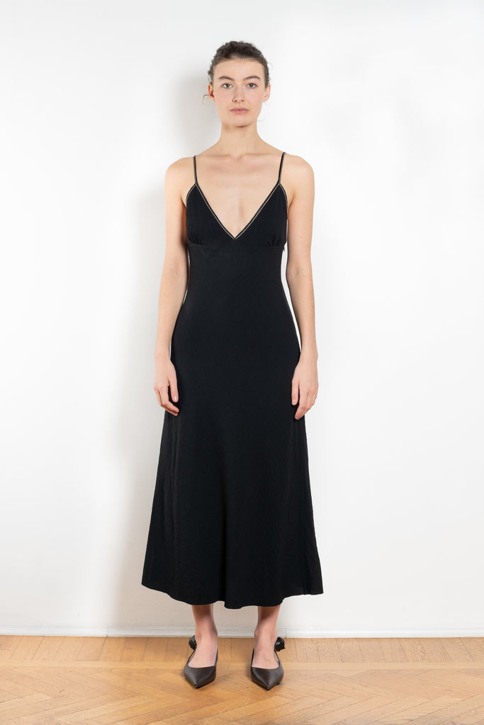 The Take Me Out Dress by Nackiye is a 90s inspired strappy A line dress with hidden elastic on the back