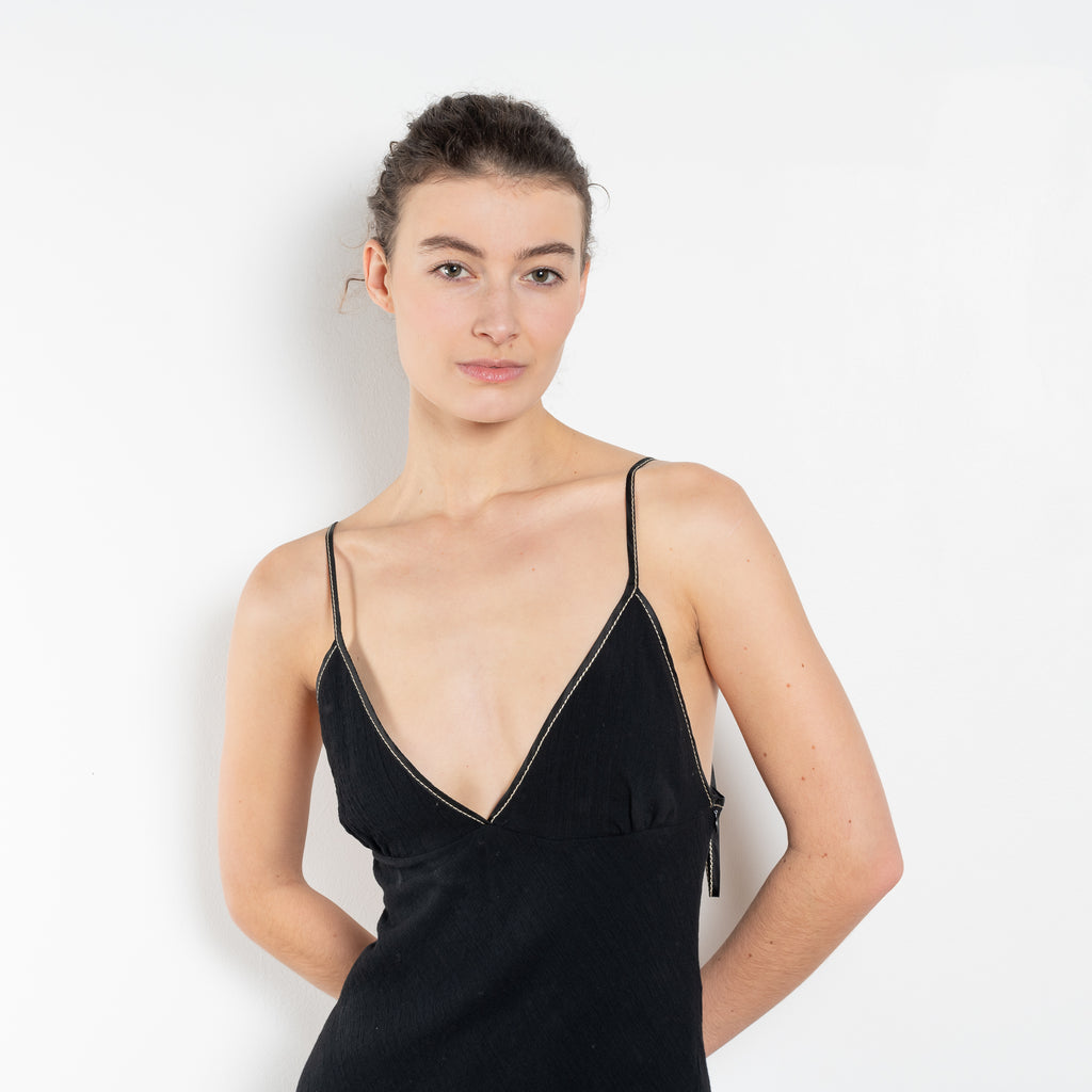 The Take Me Out Dress by Nackiye is a 90s inspired strappy A line dress with hidden elastic on the back