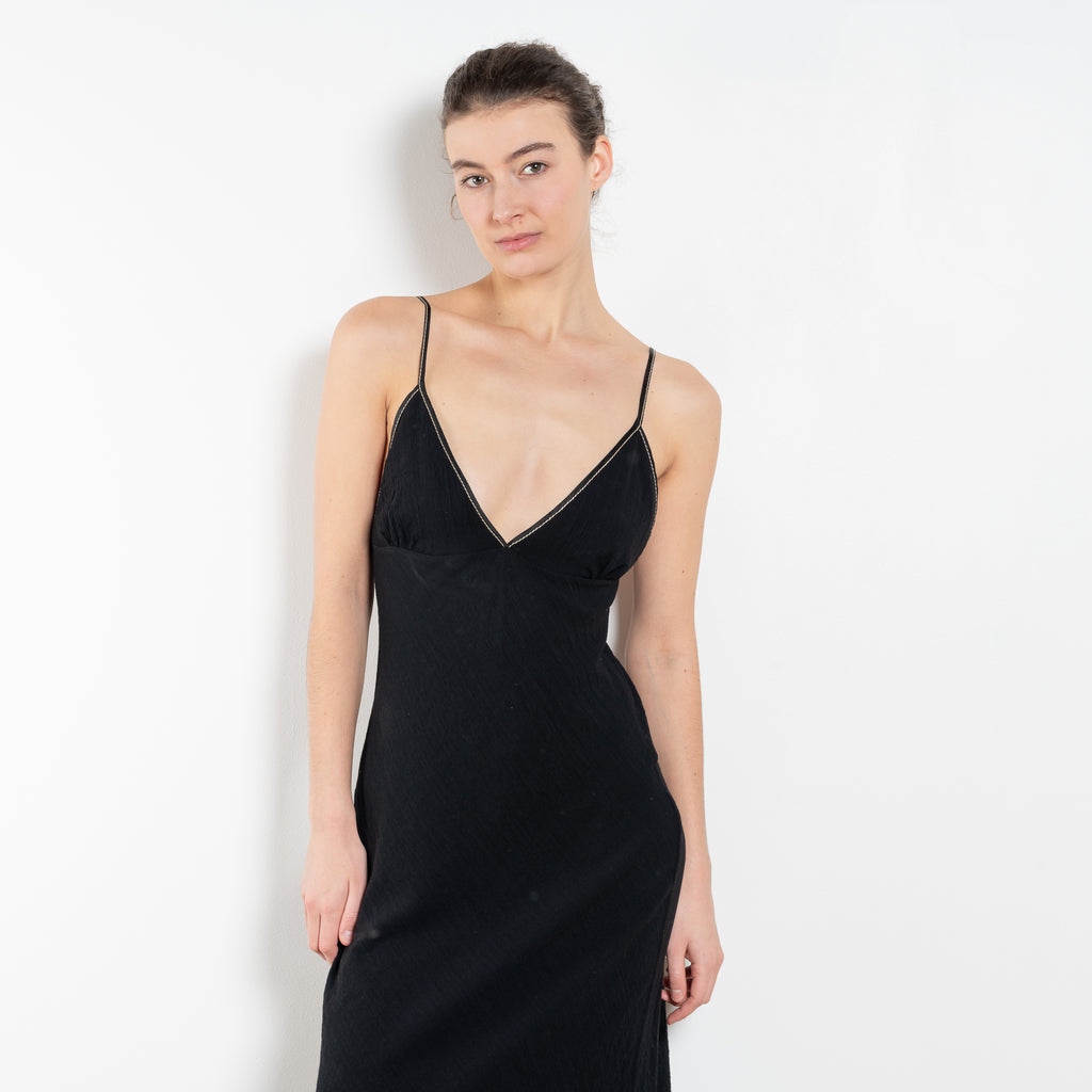 The Take Me Out Dress by Nackiye is a 90s inspired strappy A line dress with hidden elastic on the back