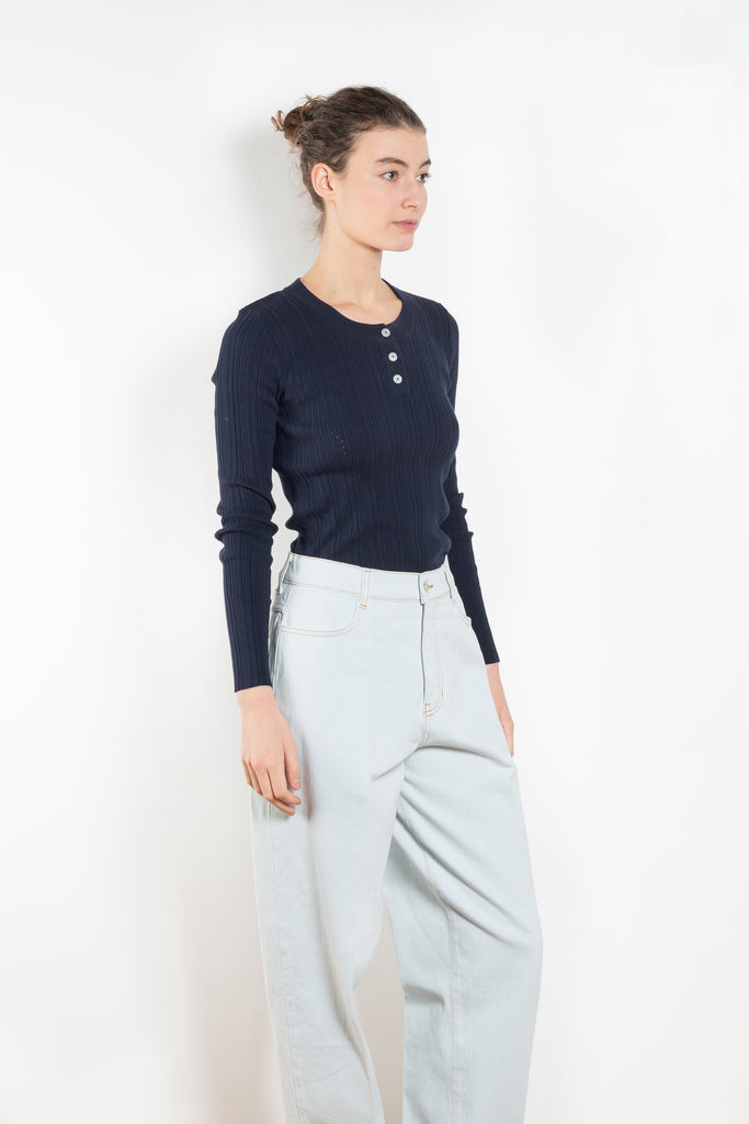 The Keep Close Top is a tightly ribbed buttoned Henley crew neck. A perfect layering addition.
