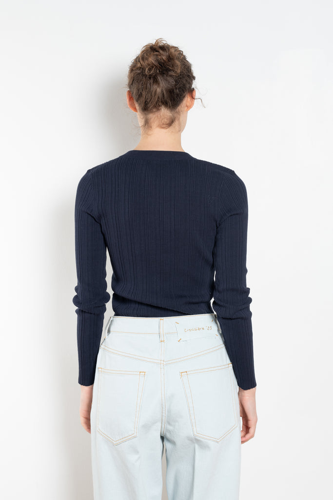 The Keep Close Top is a tightly ribbed buttoned Henley crew neck. A perfect layering addition.
