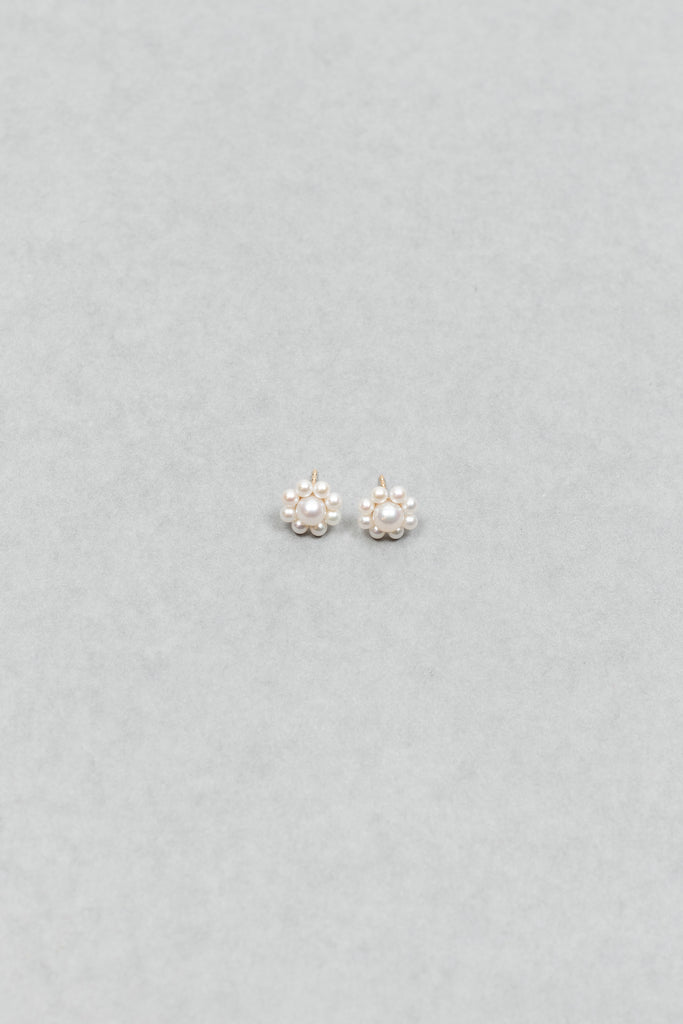 The Margherita Earrings by Sophie Bille Brahe are delicate 14Kt Gold earrings with freshwater pearls arranged to resemble flowers.