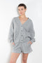 The Benny Cardigan by Xirena is a soft fleece cardigan with baseball inspired details