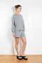 The Honor Sweatshirt by Xirena is a soft fleece sweater with a slight cropped fit and raw cut hem