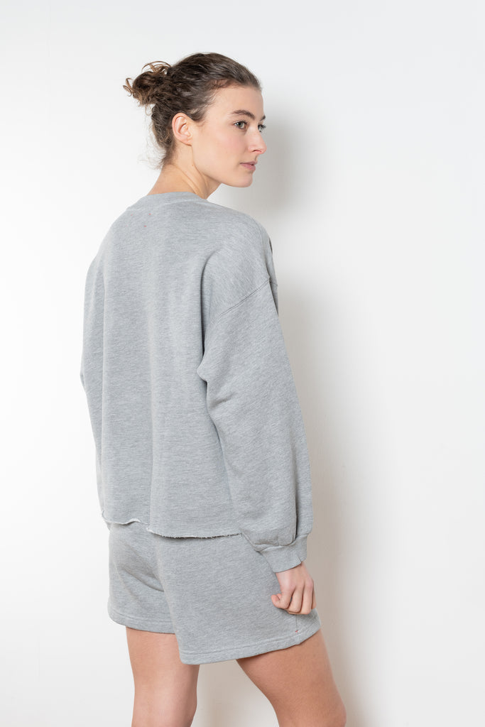 The Honor Sweatshirt by Xirena is a soft fleece sweater with a slight cropped fit and raw cut hem