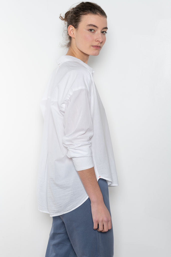 The Jordy Shirt by Xirena is&nbsp;an easy button-front shirt with a boxy fit, left chest pocket, and high low shirttail hem