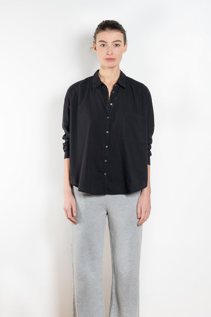 The Jordy Shirt by Xirena is an easy button-front shirt with a boxy fit, left chest pocket, and high low shirttail hem