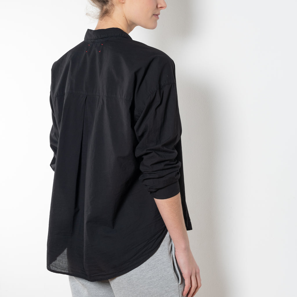 The Jordy Shirt by Xirena is an easy button-front shirt with a boxy fit, left chest pocket, and high low shirttail hem