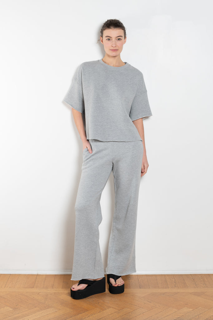 The Romeo Sweatshirt by Xirena is a soft fleece sweater with short sleeves in a slight cropped fit with a raw cut hem