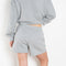 The Shayne Sweatshort by Xirena is a soft fleece short with a relaxed fit, small side slit and pockets