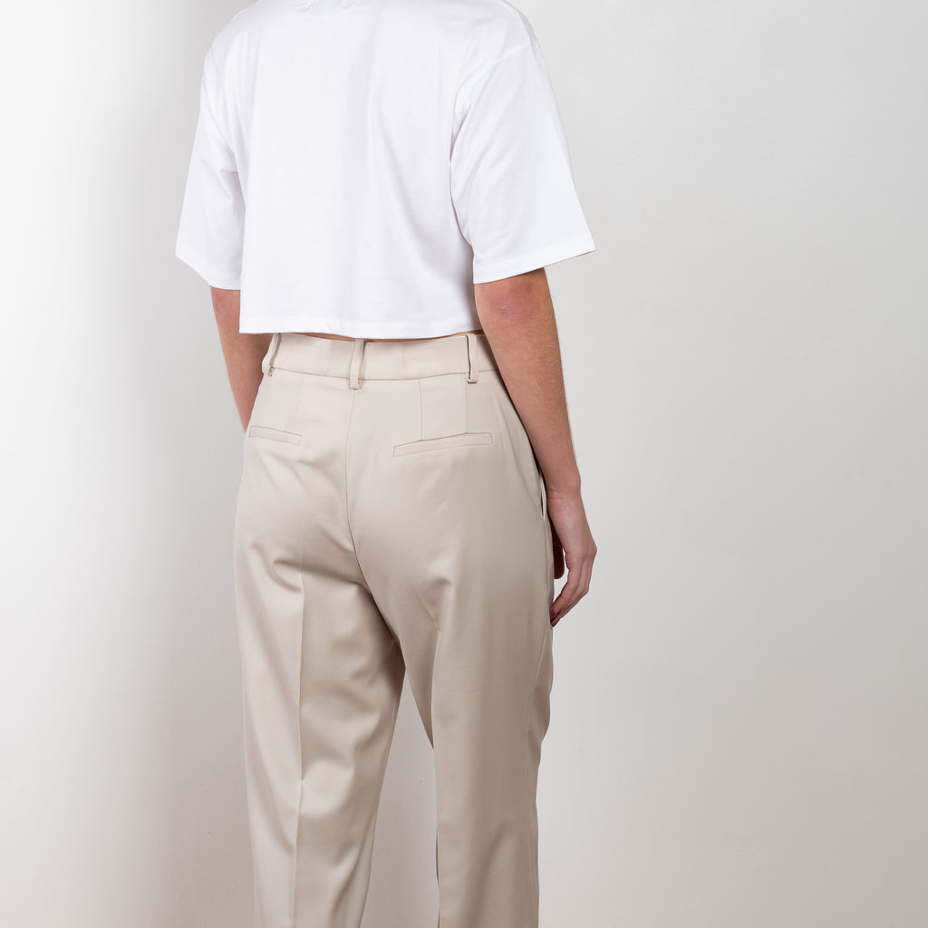 The New Sbiru Pants by Loulou Studio are signature suiting paints that sit on the waist, are ample and pleated at the waist